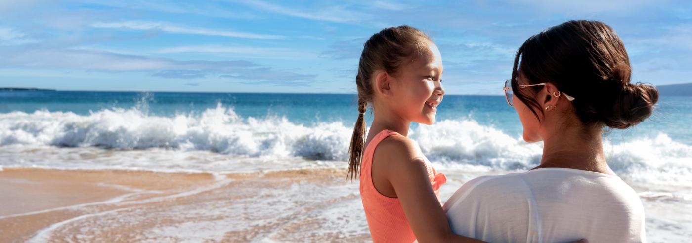 Mother and daughter by the water